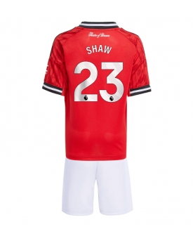 Manchester United Luke Shaw #23 Maglia Gara Casa Repliche 2025-26 Bambino Maniche Corte